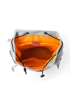 Minimalist gray backpack with vibrant orange interior, open top view showing spacious compartments.