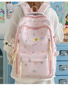 Pink school backpack detail view with star prints, large capacity daily campus bag.