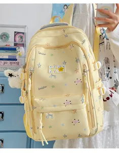Korean style yellow campus backpack with cute star patterns and plush pendant for daily school use.