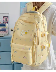 Korean style yellow canvas backpack for students, large capacity casual daypack with cute stars.