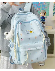 Light blue Korean style canvas backpack detail showing star prints and cute pendant.