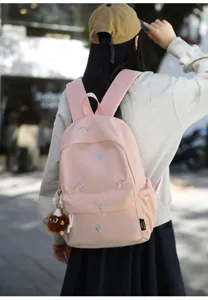 Japanese cute embroidered backpack for schoolgirls, stylish casual travel daypack in pink color.