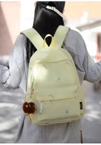 Cute Japanese embroidered backpack for middle school girls, stylish casual travel daypack.