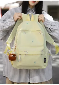 Japanese style cute embroidered backpack for women, lightweight school bag with rainbow patterns.