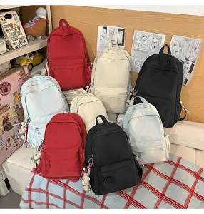 Casual solid color school backpack set with cute bear pendant for daily commute and travel.
