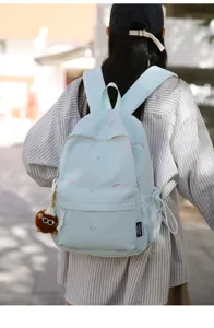 Japanese cute embroidered backpack for women, light blue casual school bag with charming details.