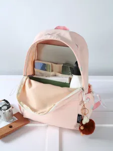 Japanese cute embroidered pink schoolbag for girls, lightweight travel casual backpack with pendant.