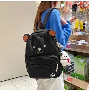 Cute cartoon corduroy backpack for women, casual black travel school bag with bear design.
