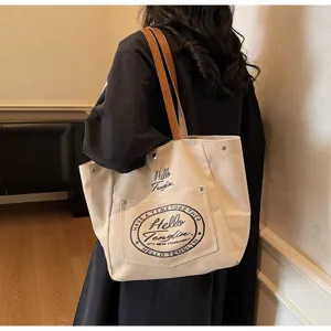 Sac cabas en toile pour femme, sac à épaule décontracté avec anses en cuir et imprimé élégant.
