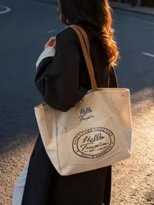 Sac cabas bandoulière décontracté en toile pour femme, design minimaliste et imprimé.