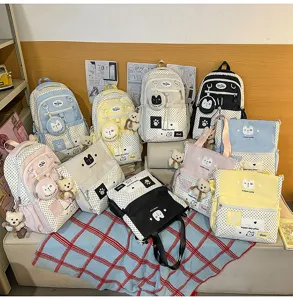 Korean style polka dot student backpack set, cute casual school bag with bear pendant and large capacity.