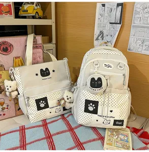 Detail view of Korean style polka dot canvas backpack and tote bag set with cute cat embroidery.