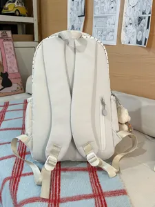 Korean style polka dot canvas backpack for women and students. Large capacity casual school bag.
