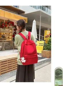 Japanese style large capacity red school backpack for students, simple and casual use.