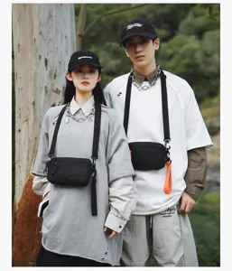 Stylish black crossbody bag for men and women, casual outdoor daily mobile phone bag.