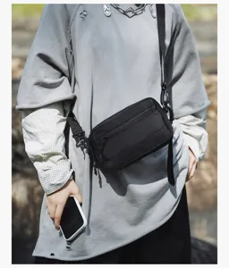 Black casual crossbody bag for men and women, lightweight daily commuter and outdoor sports bag.