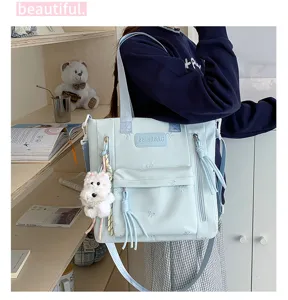 Sac bandoulière en toile décontracté, broderie nœuds, pendentif chien en peluche et grande capacité.