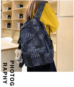 Casual street style student backpack with dark pattern, multi-pocket laptop schoolbag.
