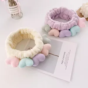 Cute plush face washing headband with colorful heart decorations, soft and comfortable daily use.