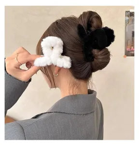 Cute plush hair claw clips for women, soft fuzzy winter hair catch clips for styling.