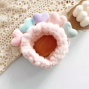 Cute plush face washing headband with colorful hearts, sweet Korean style hair accessory for women.