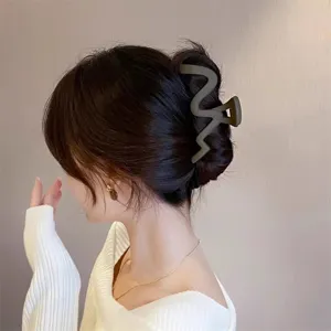 Large matte wave hair claw clip for women, elegant geometric shark clip for updos.