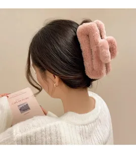 Detailed view of the plush hair claw clip, soft furry texture for autumn and winter.