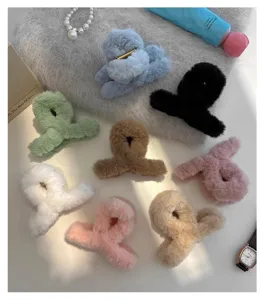 Plush hair claw clip detail shot, cute winter fuzzy shark clip for women and daily hairstyles.