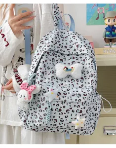Japanese ins style cute blue leopard print backpack with plush bunny and star charms for girls.