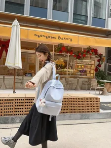 Japanese style casual light blue backpack large capacity school bag for daily use.