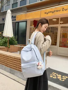 Detailed view of casual light blue backpack for women, stylish large capacity school bag.