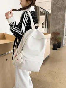 Japanese style white large capacity school backpack for women and teenage girls daily use.