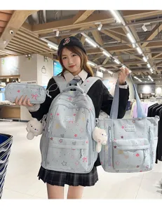 Cute star bow print school backpack set detail view showing tote bag and matching accessories.