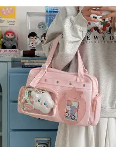 Japanese pink large capacity ita bag detail view, features clear transparent window and cute star pocket.