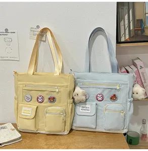 Borsa tote in tela dettaglio, borsa studentesca multitasche con tasca trasparente PVC.