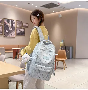 Detail shot of the Japanese style star patterned school backpack in a cozy indoor cafe scene.
