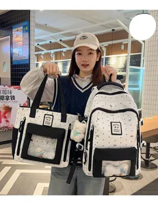 Detail view of cute polka dot ita bag and matching backpack with clear window.