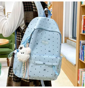 Japanese simple casual blue polka dot backpack with cute bear pendant for school students.