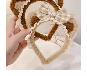 Plush bear ear headband detail, sweet lace trim and cute plaid bow hair accessory.