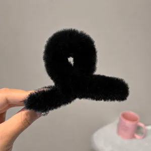 Fluffy black plush hair claw clip for women, soft winter hair styling catch clip, 9cm size.