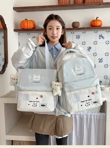 Set zaino e borsa a tracolla per studenti con dettaglio di simpatico motivo di gatto.