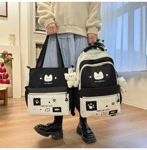 Delizioso set di zaino e borsa a tracolla a pois neri e bianchi per studenti.