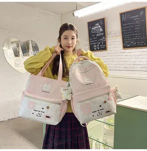 Set zaino e borsa per studenti in simpatico design a pois rosa con dettagli di gatti graziosi.