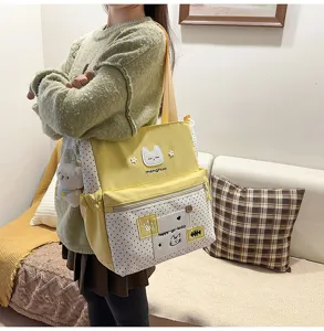 Borsa a tracolla in tela per studenti, simpatico design di gatto con motivo a pois.
