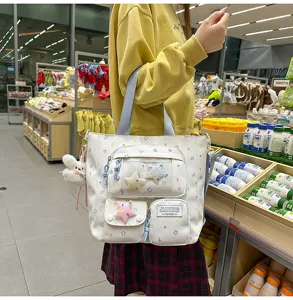 Korean style star print casual backpack and tote bag with multiple pockets and cute charms.