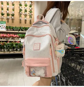 Cute pink polka dot ita backpack with clear front pocket, sweet school bag for daily use.