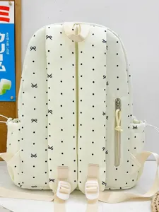 Cute Japanese style minimalist backpack for women and students with black polka dots and bows.