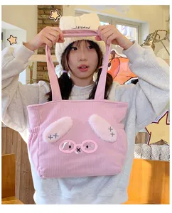 Cute pink corduroy tote bag with 3D bunny ears and glasses design, perfect lunch bag.