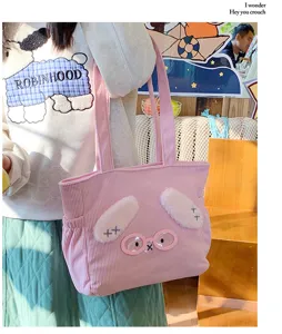Cute pink corduroy tote bag with plush bunny ears and glasses detail, perfect for daily use.