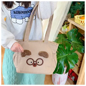 Cute Japanese style corduroy lunch bag with bear ears and glasses design for women daily use.